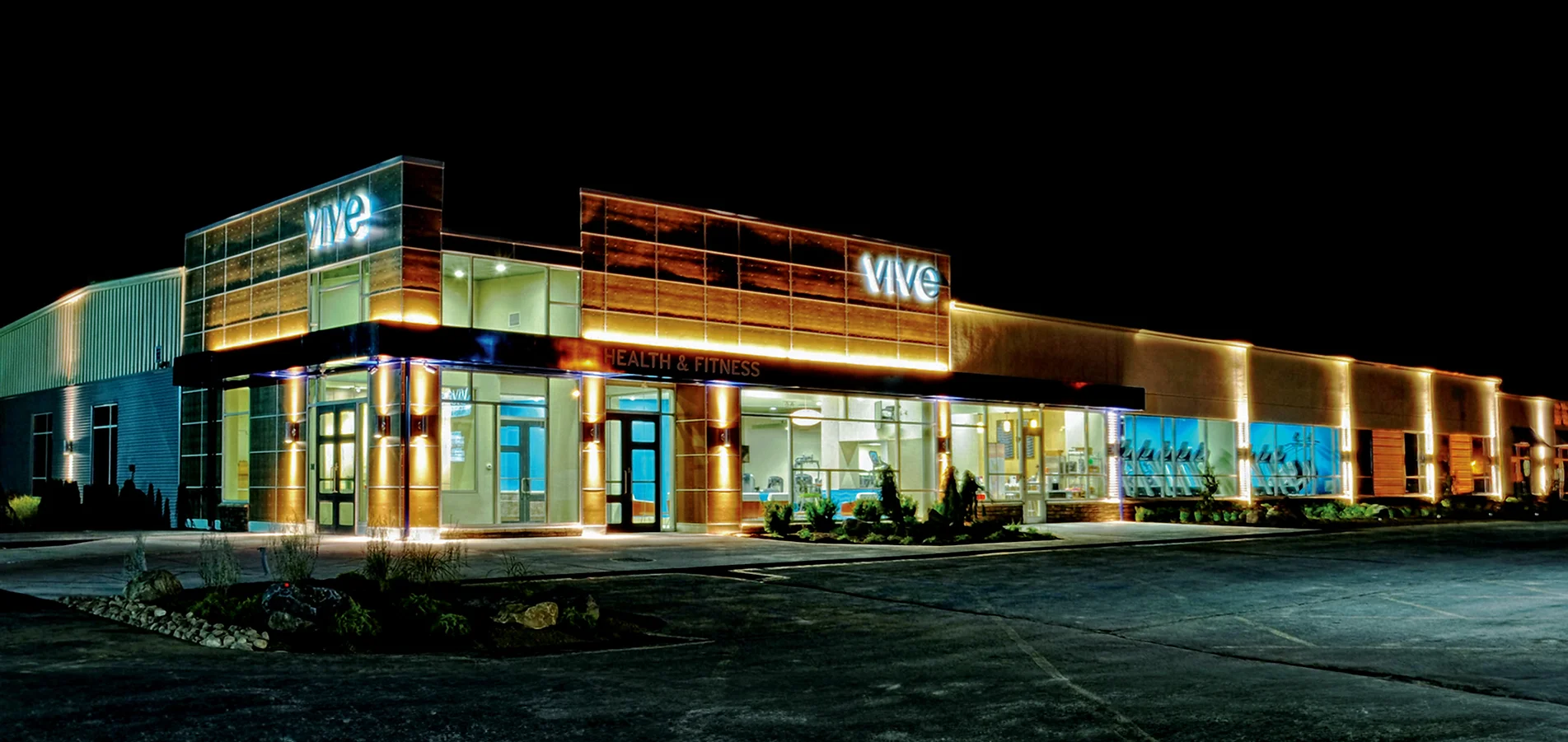 VIVE Health & Fitness club exterior at night in Kingston, PA