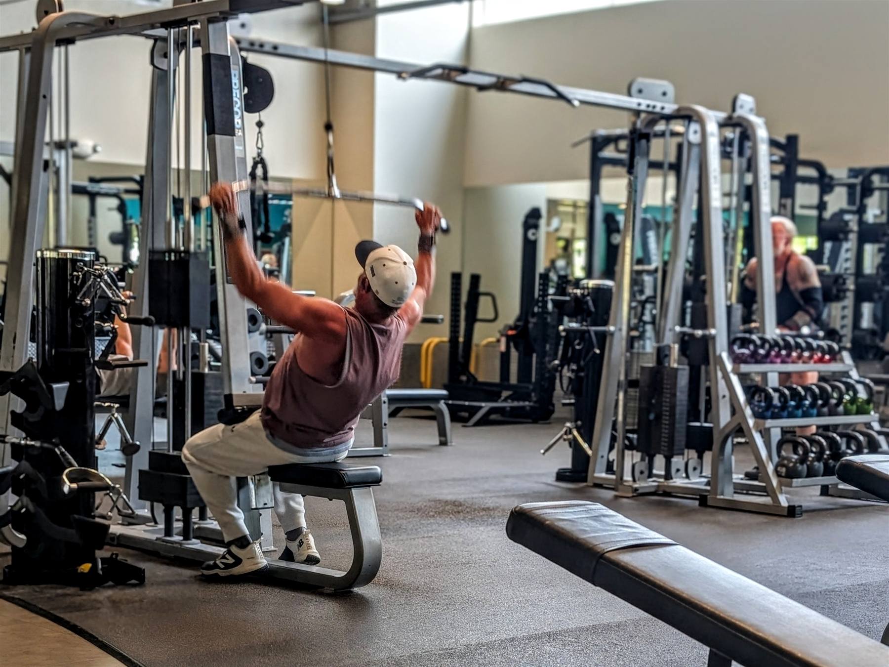 Member training on the strength floor at VIVE Health & Fitness